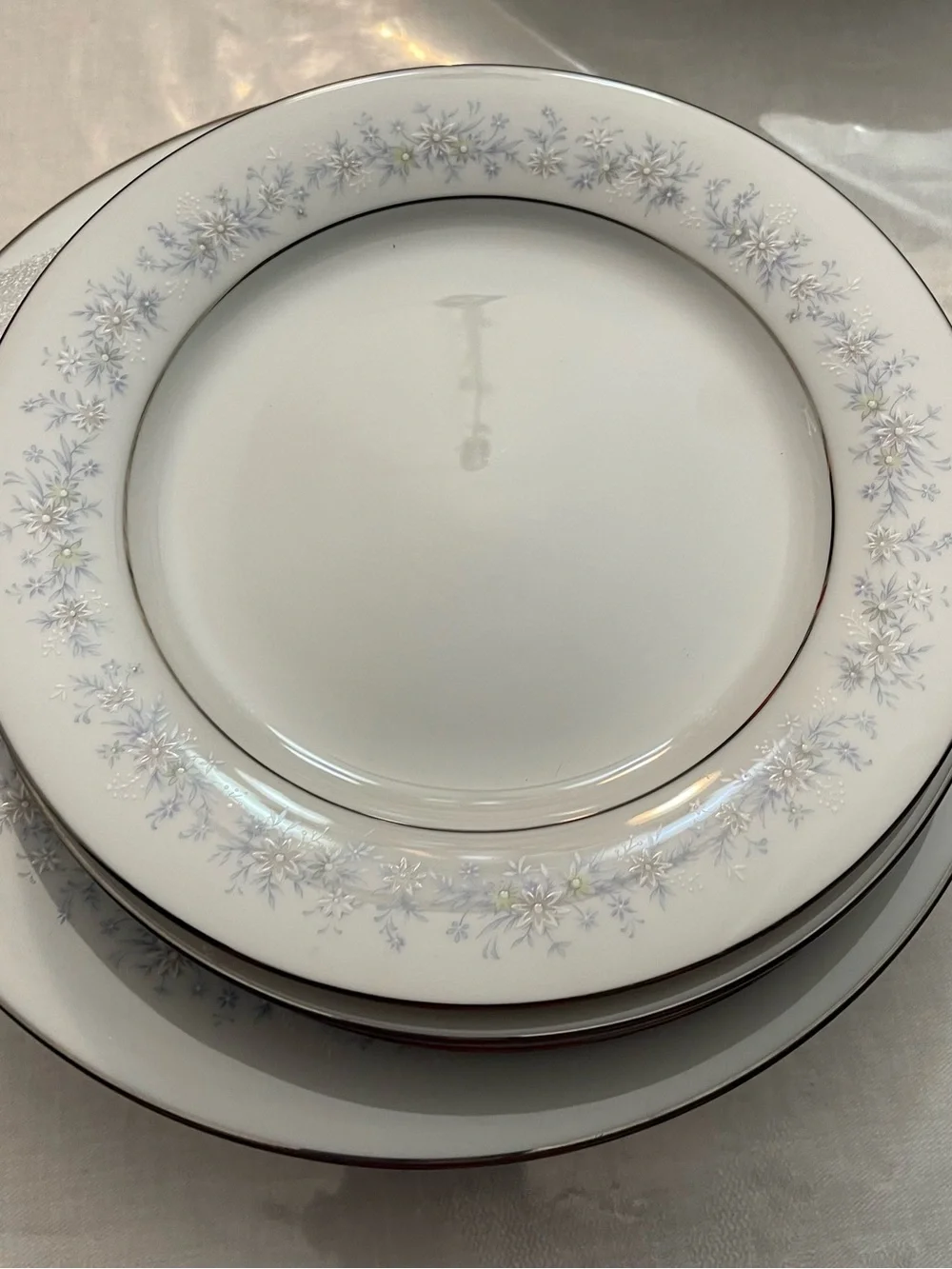 Noritake White Dinner Plate with Pale Blue Floral and Silver Trim